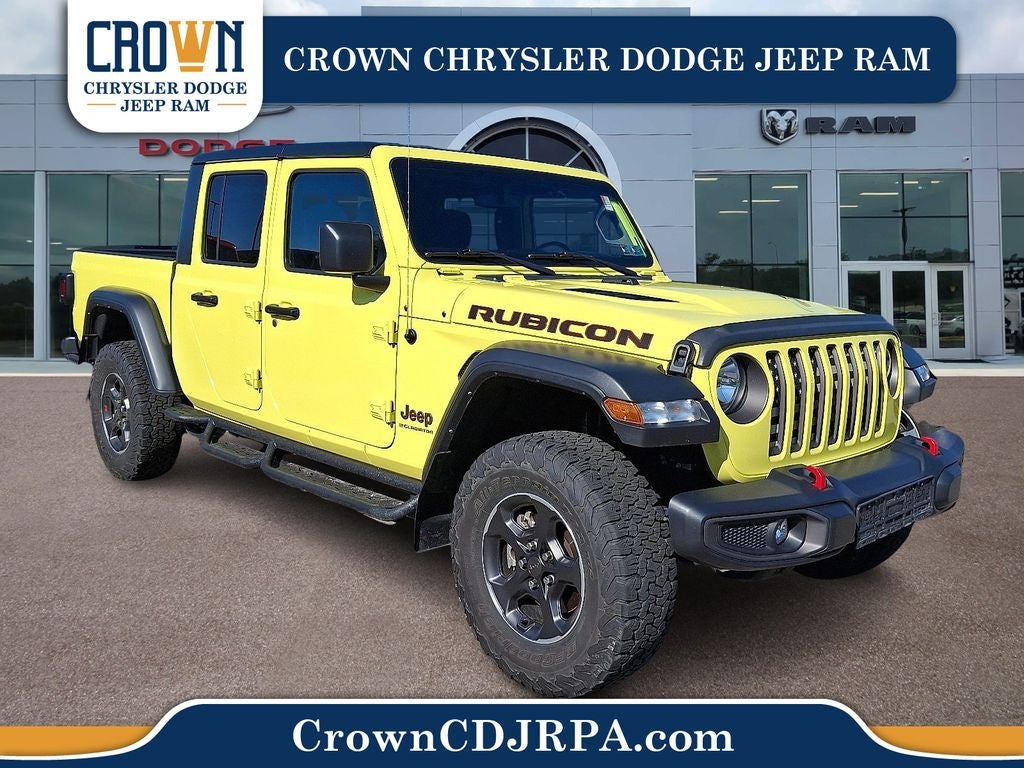 2023 Jeep Gladiator Rubicon in High Velocity Clearcoat — front three-quarter view