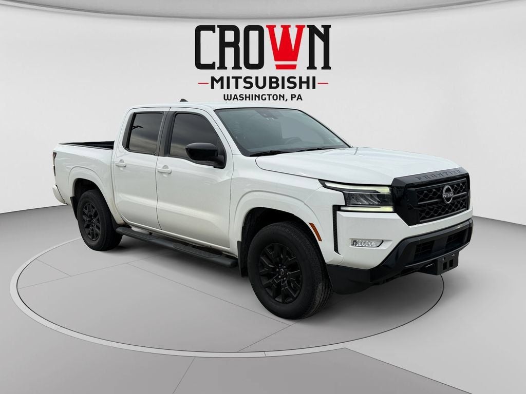 2023 Nissan Frontier SV in Glacier White — front three-quarter view