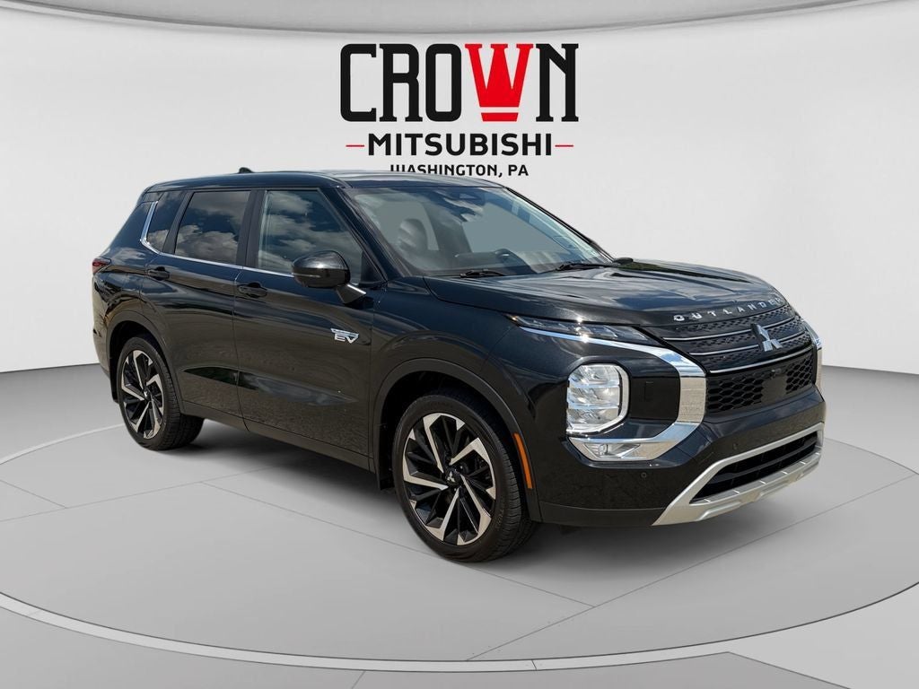 2023 Mitsubishi Outlander PHEV SE tech in Black Diamond — front three-quarter view
